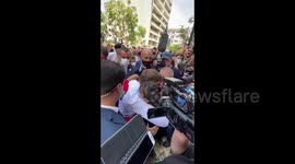 French President Macron shares embrace with emotional Beirut citizen