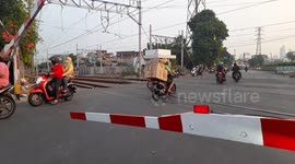 Residents Breaking Train Door Bars in Senen, Central Jakarta, Indonesia