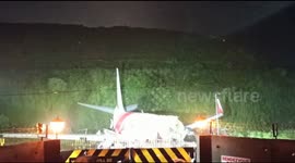 Shocking footage shows India Air Express plane split into two