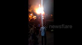 A resident's house which is also used as a shop in a densely populated residential area on fire