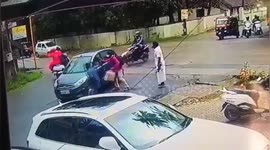 Mirclously survive women as was drageed five meter by car in Southern India.