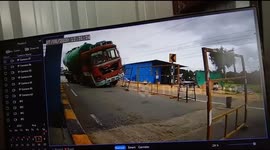 Toll gate staffer runs for safety when truck with failed brakes smashes through barricade