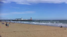 Cruise liners anchored off Bournemouth beach,