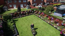 Gardener fills more than 100 hanging baskets in his garden every year