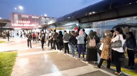 Commuters seen flouting social distancing guidelines at train station in Jakarta, Indonesia