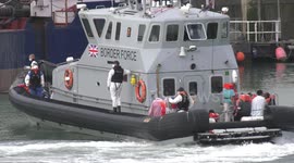 Migrants crossing English Channel brought ashore by UK Border Force