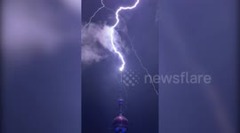 Lightning strikes Shanghai's Oriental Pearl Tower during storm