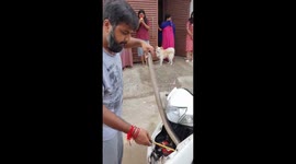 Cobra pulled from inside of scooter in central India