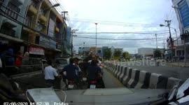 Schoolboy rides pillion with his own broken-down scooter on his lap