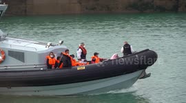 Further footage shows migrants brought ashore from English Channel