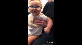 Baby reacts to seeing himself for the first time wearing glasses