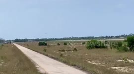 Military plane crash lands by skidding along nose after front wheel fails