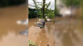 Cars submerged in South Korea floods