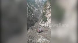 Heavy rain causes mass mudslide which destroys road leading to northern Indian village