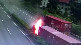 Chinese driver jumps out of truck to escape after the vehicle crashes into central reservation and catches fire