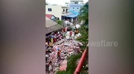 Frantic neighbours loot hundreds of cans of beer from overturned truck in Cambodia