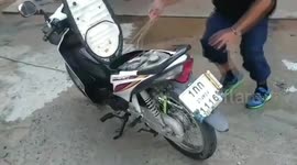 Shocked motorcycle rider finds snake living under the seat