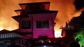 Fire injures two and rips through 90 homes in Bangkok, Thailand