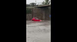 Bizarre moment 2 cars in Scotland float on flooded road
