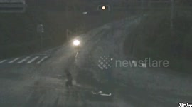 Chinese man narrowly escapes being crushed by truck after jumping off his scooter