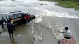 Car carrying four people rescued by villagers from heavy flow of water in India