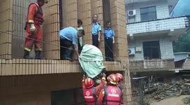 Firefighters rescue 47 people trapped in Chinese train station due to landslide