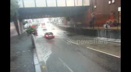 Further footage shows cars drive straight through flooded bridge in Greater London