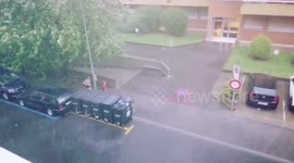 Switzerland: Lady Braves Through A Severe Thunderstorm In Geneva