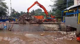 Piles of Plastic and Wood Trash Mounts at Magarai Water Gate, Central Jakarta, Indonesia