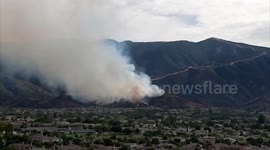 Plane drops fire retardant on Skyline fire in California as evacuation orders lifted