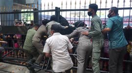Anti-mining protesters attempt to storm gates of governor's office in Indonesia