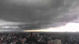 Dark grey clouds loom over Bangkok before rainstorm batters city