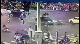 Two people land on car roof after their electric bike strikes oncoming vehicle in China