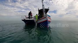 Scuba divers clean pollution from coral reef in southern Thailand