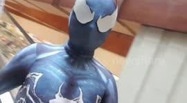 Filipino man walks round supermarket in Venom character costume