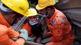 Rescuers pull man from building crushed by fallen tree in northern India