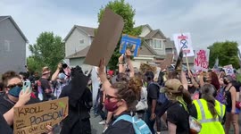 Protestors dance outside of Minneapolis Police Federation President Bob Kroll’s house