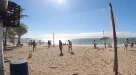 Playing tennis on the beach are funny?