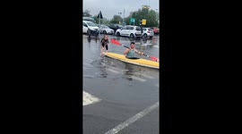 Man canoeing in car park UK