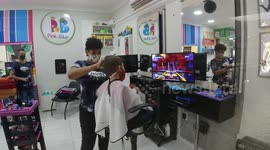 Boy having a hair cut in Vila Velha city - Brazil