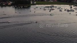 Lake-bound concert in Sweden attended by onlookers in dozens of boats to keep social distancing