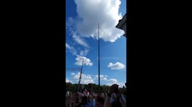 Cheers ring out as protesters fly opposition flag at full mast in Belarus
