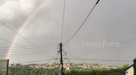 'One in a million' moment bolt of lightning strikes curvature of rainbow