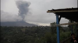 Nonchalant villagers in Indonesia watch Mount Sinabung's continued eruptions