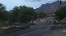 Flash flooding in Tucson, Arizona.  The waters are black with soot and debris from the recent Bighorn Fire that raged for more than a month in the Santa Catalina mountains.
