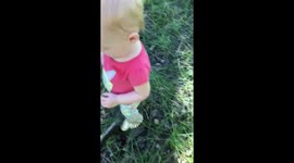 Scared sister stomps on frog