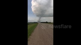 Locals watch on as tornado in distance tears through southern Canada