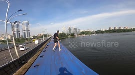 Daredevil jumps from a moving train into river below