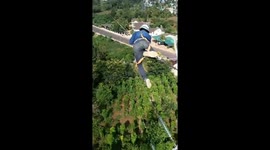 Vietnamese electric workers work at a height of 100 meters to repair high-voltage power lines