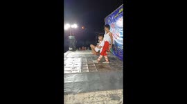 Young man spins boy from his neck in daring performance in Vietnam